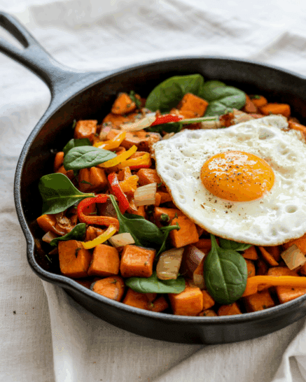 a cast iron with sweet potato hash breakfast